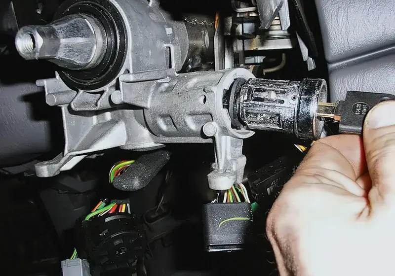 Car ignition cylinder being repaired or replaced by a mobile locksmith